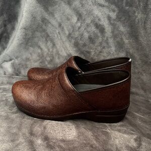 Dansko Dark Brown Embossed Clogs